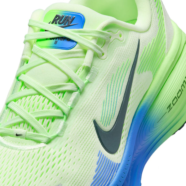 Neon green running shoe with blue accents on a white background