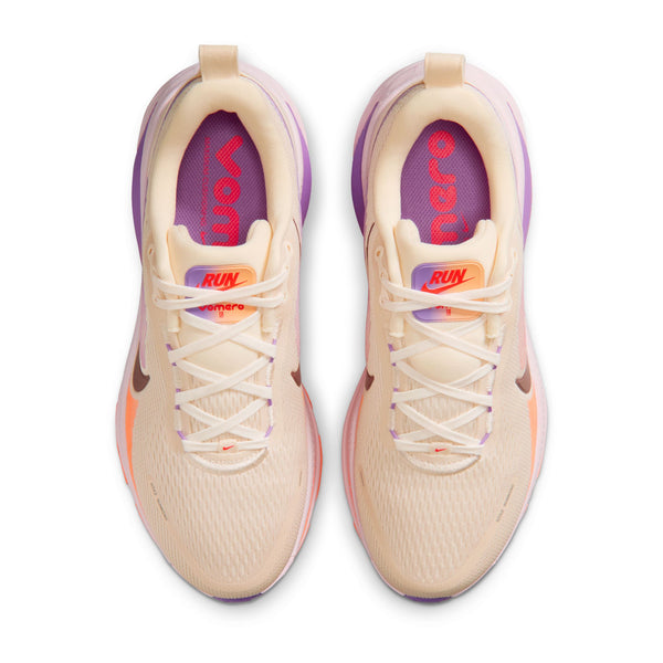 A pair of Women's nike runnin shoes from the top view detailing the brighly colored sock liner.