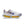 White running shoe with colorful sole on a white background