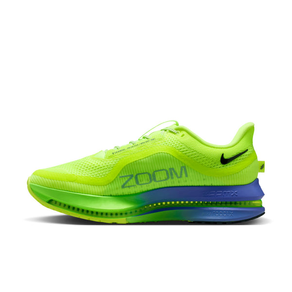 Bright green running shoe with blue sole on a white background