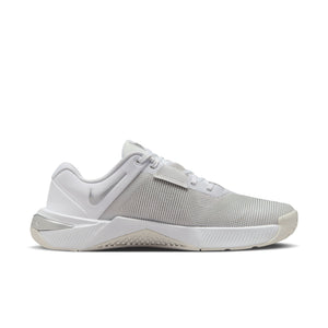 White Nike gym/athletic shoe on a white background.