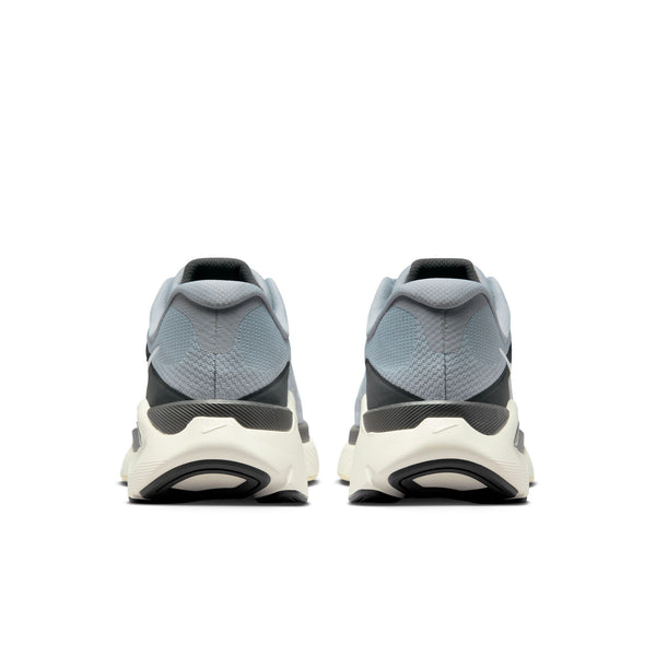 Pair of gray and white athletic shoes on a light gray background