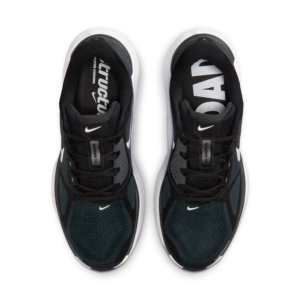 Black and white athletic shoes with visible brand logos on a white background