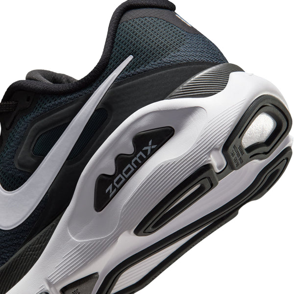 Black and white running shoe with 'ZoomX' branding on a white background