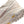 Close-up of a beige and brown shoe with 'Vibram' branding on a white background