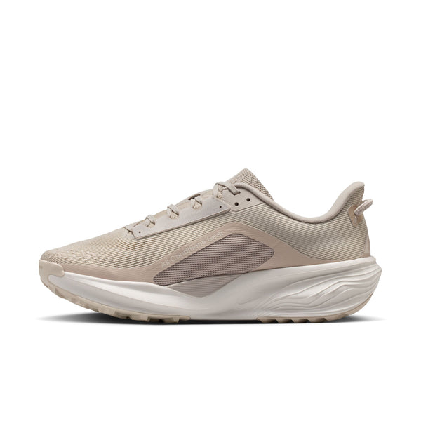 Beige running shoe on a white background