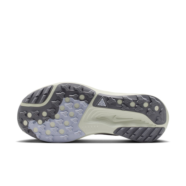 Close-up of a shoe sole with tread pattern on a white background