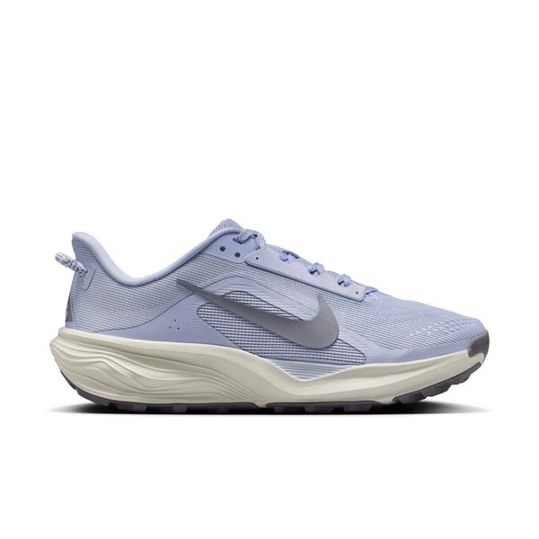 Blue trail running shoe with a white sole on a white background