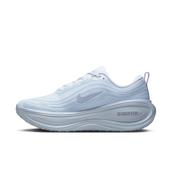 Medial side of a light blue running shoe with Nike logo on a white background.