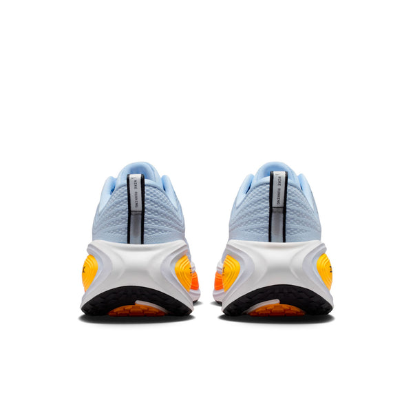 The heel of a Nike running shoe that has a neon midsole in some spots and white in others.