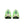Green  Nike athletic shoes with a white sole on a white background
