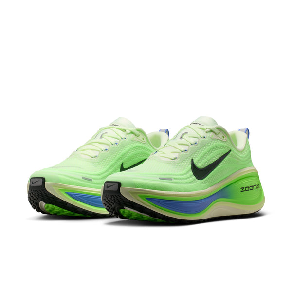 Green running shoes with Nike logo on a white background