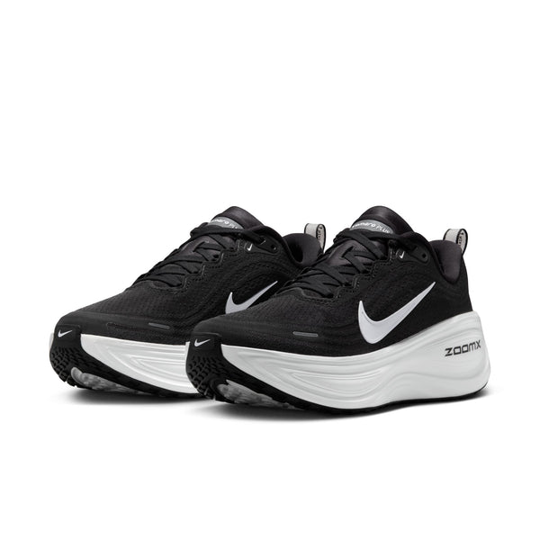 A pair of black running shoes with white sole on a white background.