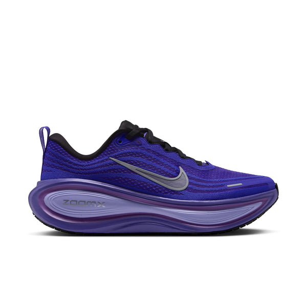 A women's Nike runing shoe with a bright purple upper.