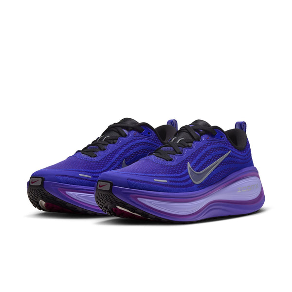 A pair of Nike Women's Vomero Plus with a black outsole adn a purple upper.