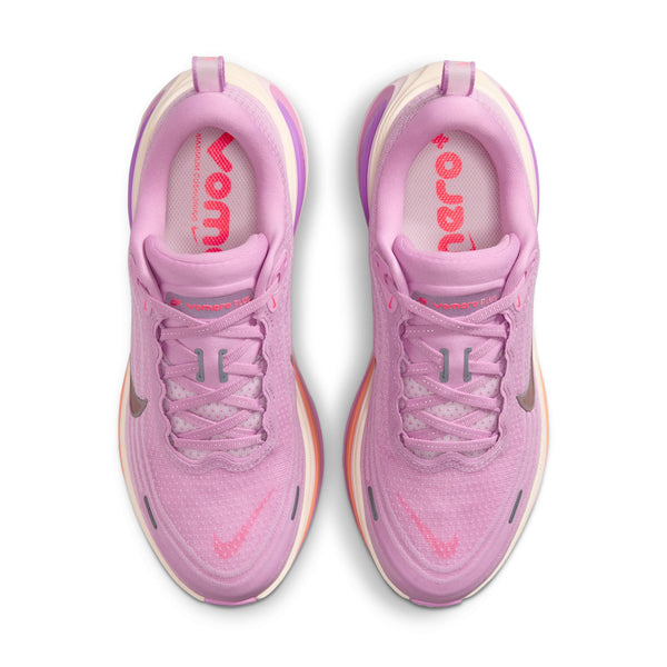 Pair of pink running shoes with visible brand logo on a white background