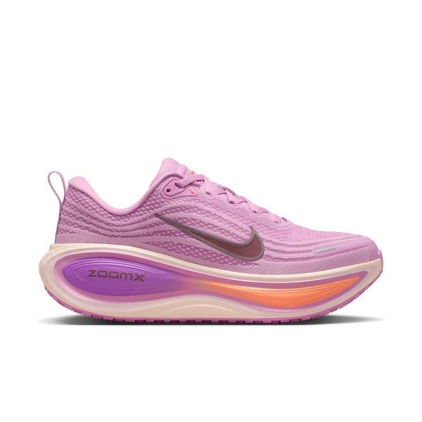 Pink running shoe with purple sole on a white background