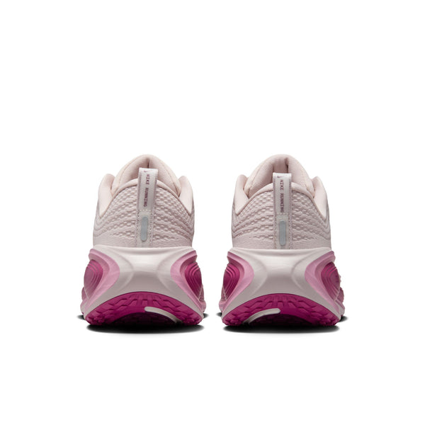 The heel area is the focus on this pink and white running shoes on a white background.
