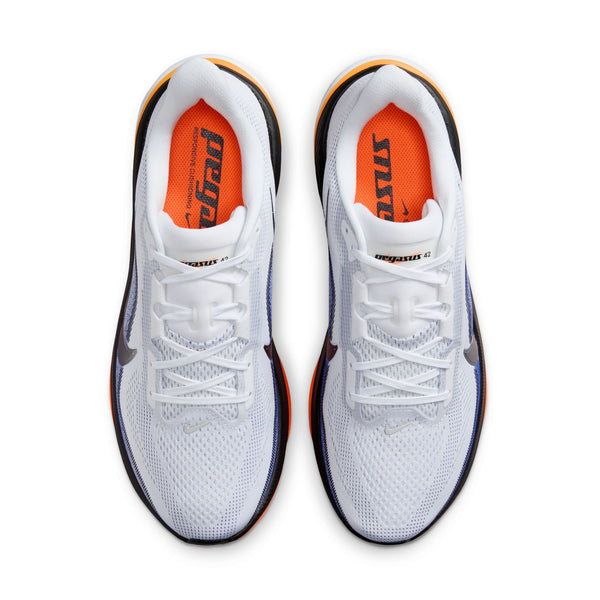 White sneakers with orange accents on a white background