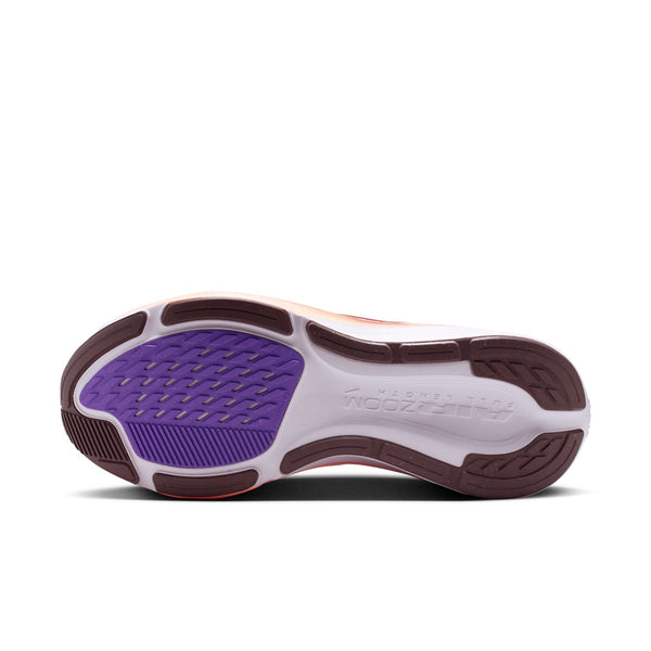 Sole of a shoe with purple and brown design on a white background