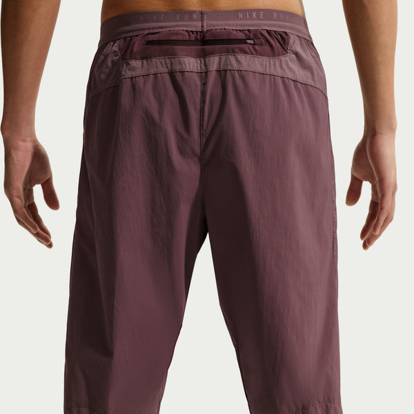 These dark wine colored running pants have a large zippered pocket just below the waist line.