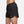 Black athletic shorts with a Nike logo on a white background