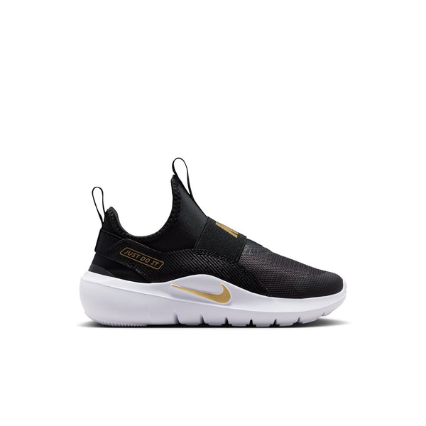 A Nike Air Max slip-on sneaker in black with gold and white accents, shown from a side profile on a white background.