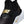 Close-up of a Nike sneaker in black with metallic gold branding and a white midsole, showing the side strap and Swoosh.