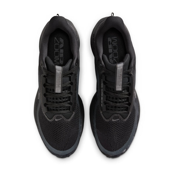 Black running shoes with 'Zoom' branding on a white background
