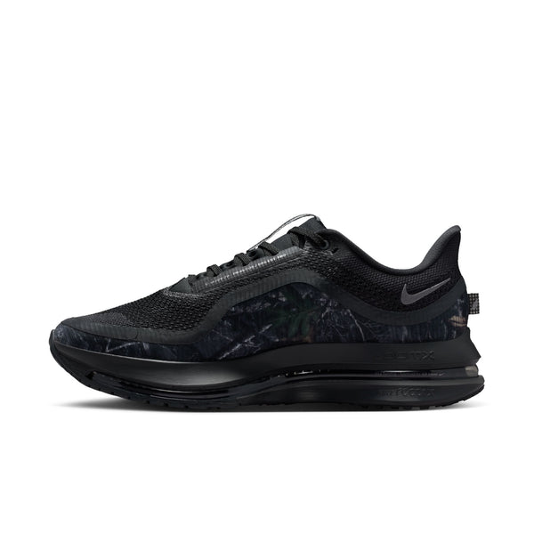 Black athletic shoe with a camouflage pattern on a white background