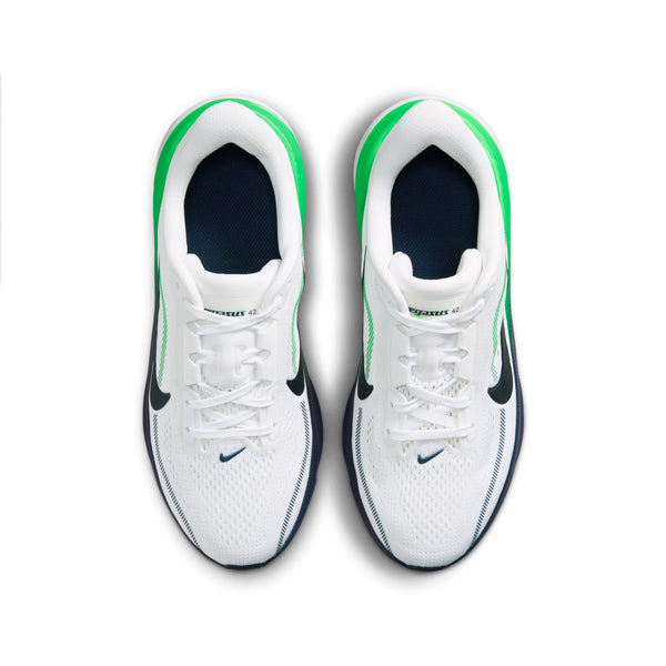 White sneakers with green accents on a white background
