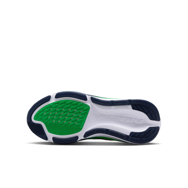 Close-up of a shoe sole with green and blue design on a white background