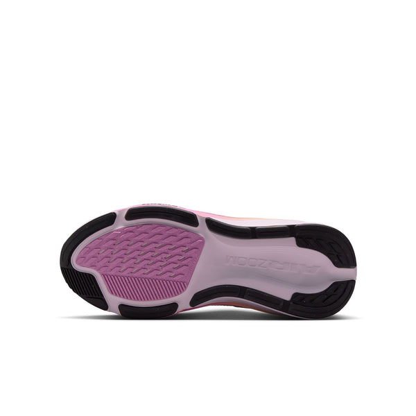 The bottom sole of a Nike running shoe, featuring a light pink and white base with a textured magenta-pink section on the forefoot and black outsole accents.