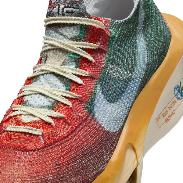 Close-up of a colorful sneaker with a prominent brand logo on a white background.