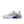 White sneaker with a blue sole on a white background