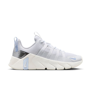 White Nike gym shoe with blue accents on a white background