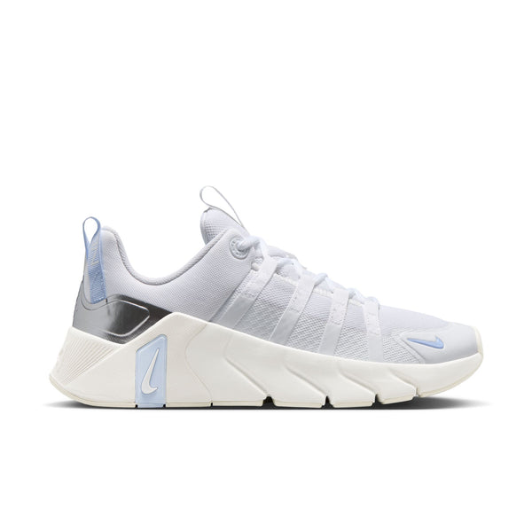 White Nike gym shoe with blue accents on a white background