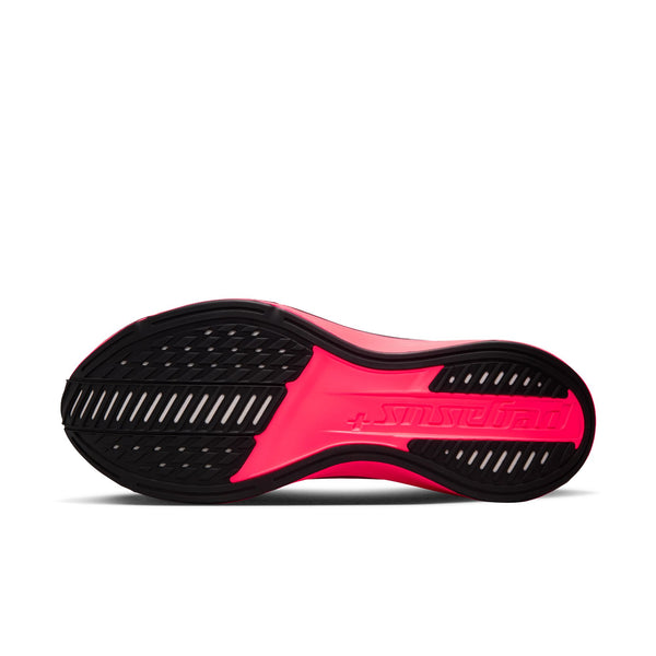 A bright pink Nike running shoe with a black and gray Swoosh logo, shown on a white background.
