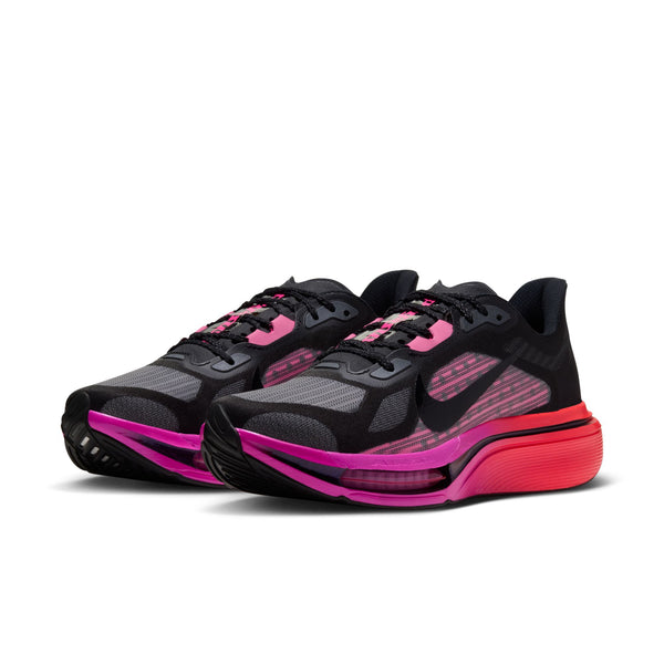 A Nike running shoe in black with vibrant pink and red accents on the midsole and upper, shown on a white background.