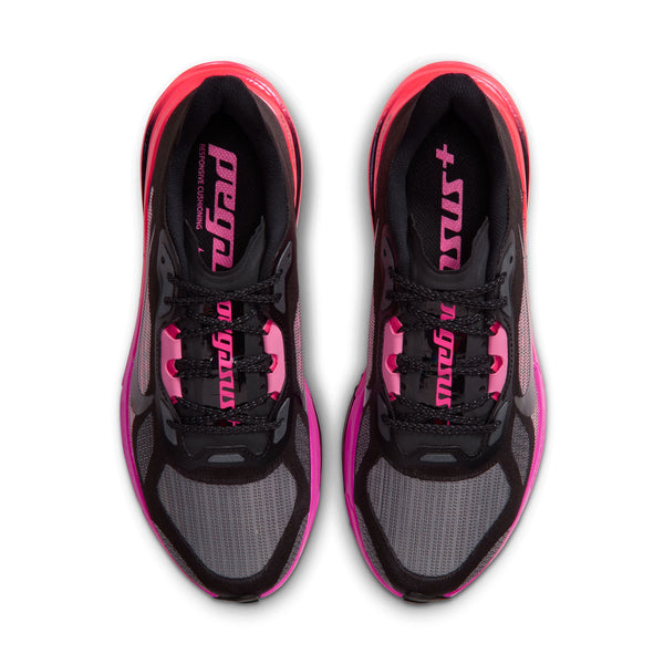 A Nike running shoe in black with vibrant pink and red accents on the midsole and upper, shown on a white background.
