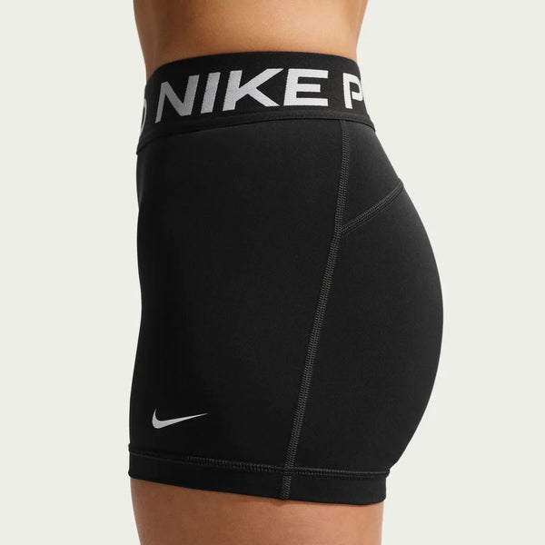 Black Nike Pro shorts on a gray background