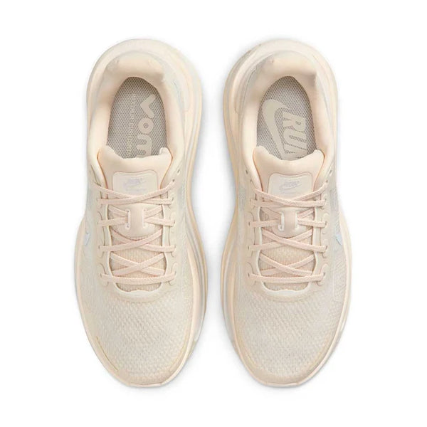 Cream running shoe on a white background