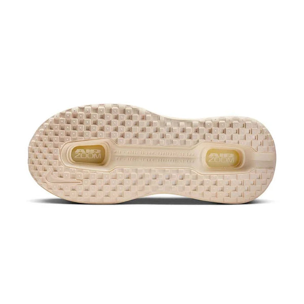 Cream running shoe on a white background
