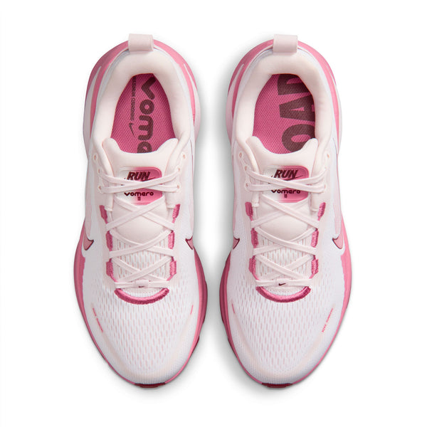 White and pink running shoes with visible branding on a white background