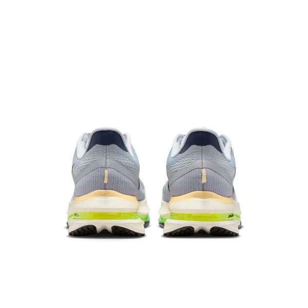 Pair of gray running shoes with yellow sole on a white background