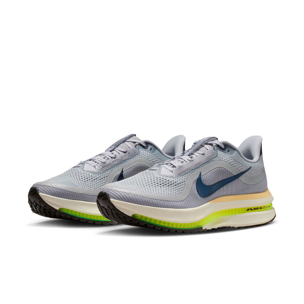 Pair of gray running shoes with a blue swoosh logo on a white background