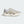 An Adidas running shoe in light gray, beige, and white, shown from a side profile on a light gray background.
