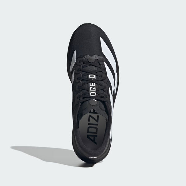 A adidas running shoe that appears to be standing on its heel.
