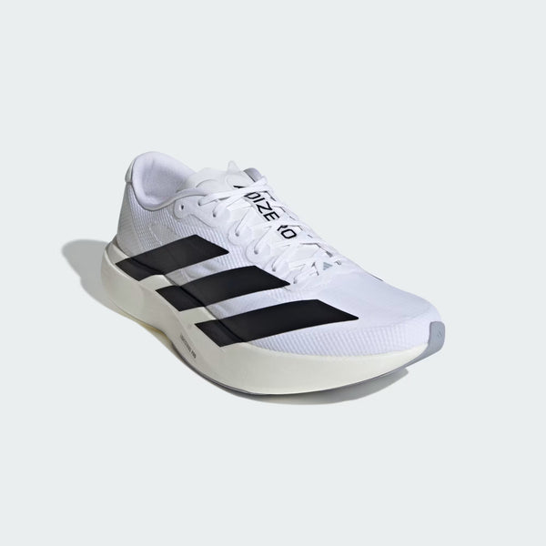 White running shoe with black stripes on a light gray background