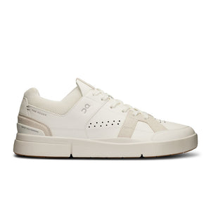 A pair of beige men's sneakers with lace-up closure and a thick white sole.